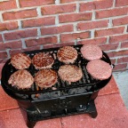 Eight burgers cooking at once